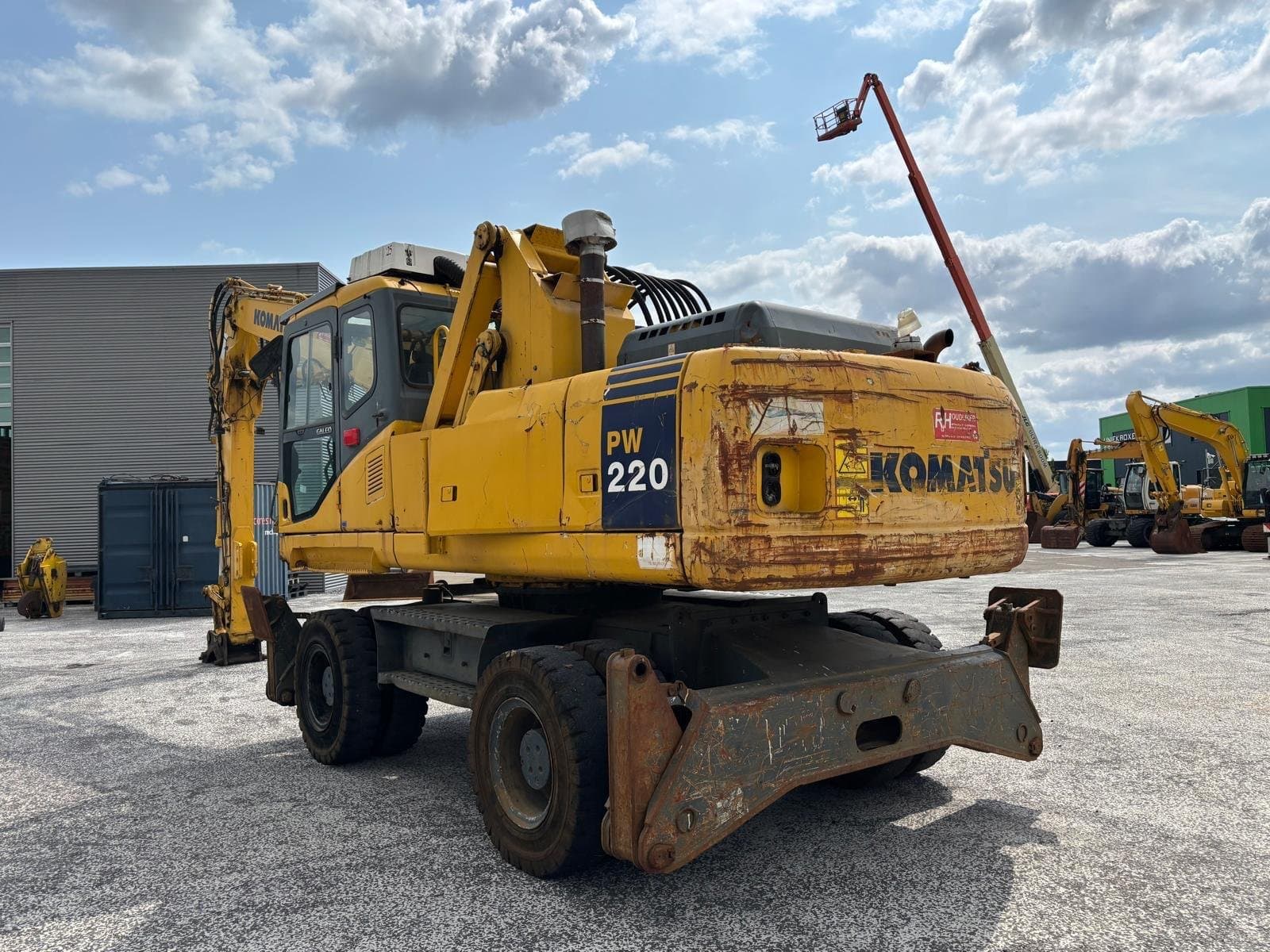 Komatsu PW220 foto 1